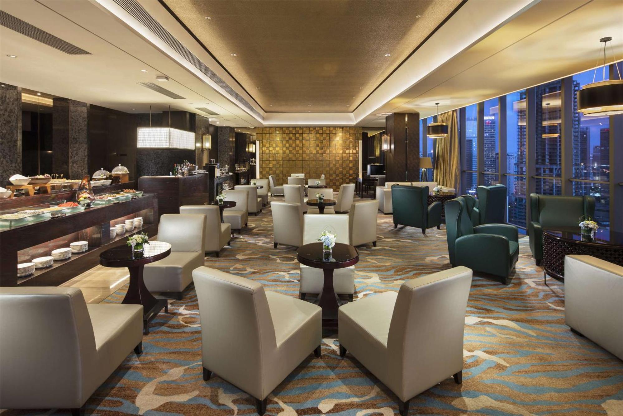 Hilton Guangzhou Tianhe - Free Shuttle Bus And Registration Counter Available During Canton Fair Period Exterior foto The Club lounge at Beijing Capital International Airport